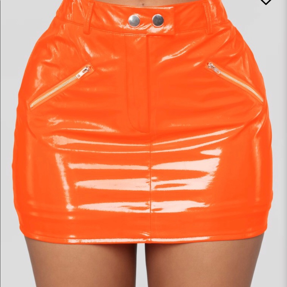 Neon orange tight leather skirt.